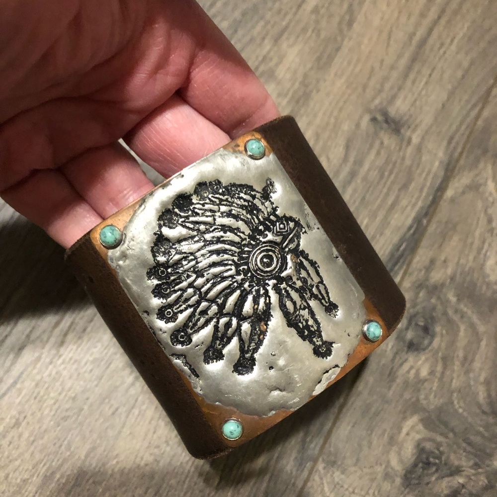 Leather cuff bracelet with headdress stamped on metal